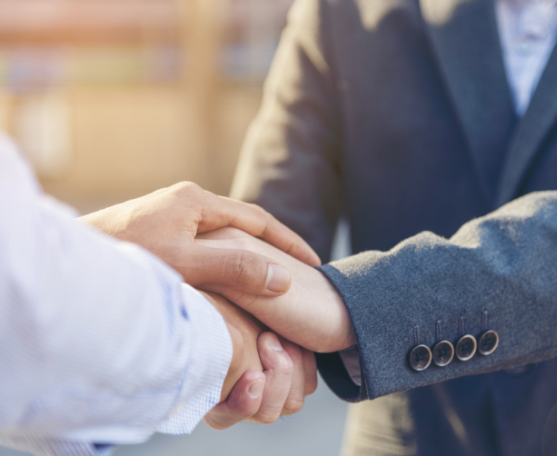attorneys shaking hands with client